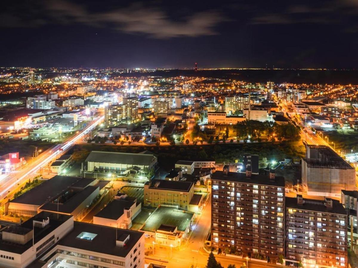 Hotel Emisia Sapporo Luaran gambar Aerial view of the city at night